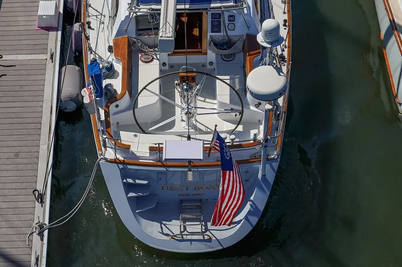 Slide: The Image of Top view of 2007 Morris Ocean Series 45 yacht docked, featuring American flag. - 7