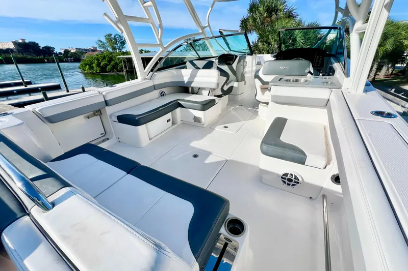 Slide: The Image of 2021 Robalo R317 Dual Console boat with spacious seating and sleek design. - 11