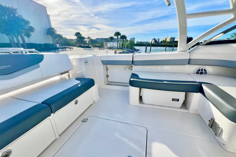 Slide: The Image of 2021 Robalo R317 Dual Console boat interior with cushioned seating and storage. - 13