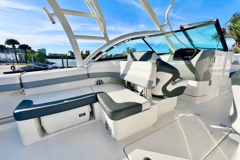 Slide: The Image of 2021 Robalo R317 Dual Console boat interior with spacious seating and waterfront view. - 14
