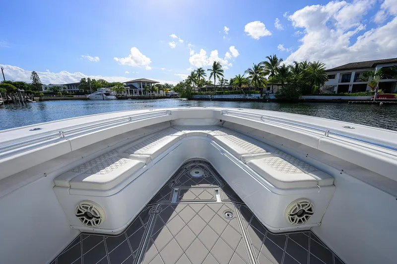 Slide: The Image of Bow seating area of 2021 Yellowfin 42 boat, with waterfront view and clear skies. - 19