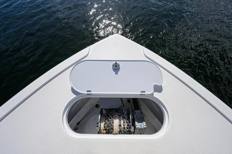Slide: The Image of Bow of 2021 Yellowfin 42 boat with anchor storage, on calm water. - 20