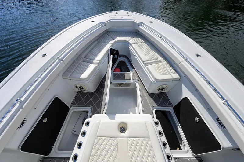 Slide: The Image of 2021 Yellowfin 42 boat interior with cushioned seating and storage compartments. - 23