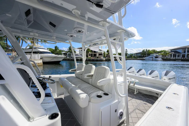 Slide: The Image of 2021 Yellowfin 42 boat interior with luxurious seating and waterfront view. - 33