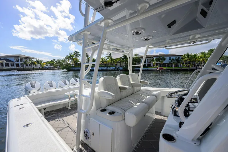 Slide: The Image of 2021 Yellowfin 42 boat interior with luxurious seating and modern design on a sunny waterfront. - 34