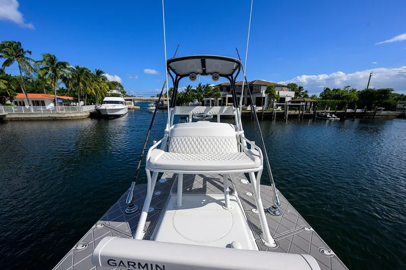 Slide: The Image of 2021 Yellowfin 42 boat on a sunny waterfront, featuring Garmin equipment. - 39