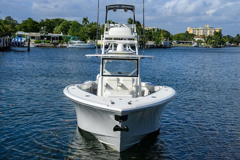 Slide: The Image of 2021 Yellowfin 42 boat on calm water, front view with clear sky background. - 6