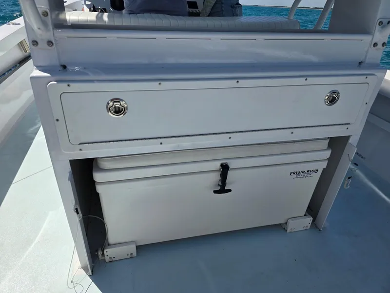 Slide: The Image of 2012 Contender Custom 33 Center Console with storage compartment and cooler on deck. - 20