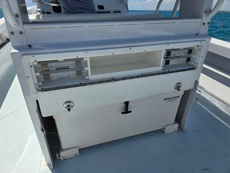 Slide: The Image of 2012 Contender Custom 33 Center Console boat interior with storage compartments. - 21