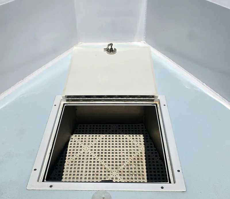 Slide: The Image of Open storage compartment on 2012 Contender Custom 33 Center Console boat. - 8