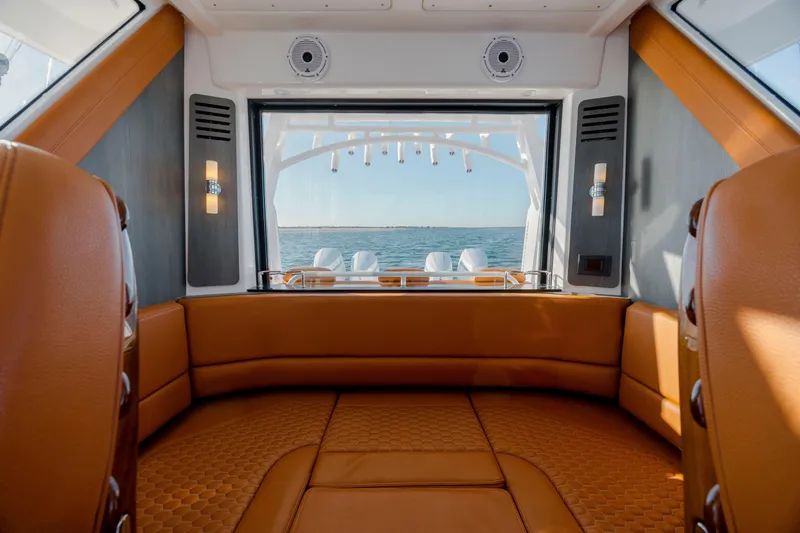 Slide: The Image of Luxurious interior of 2024 Invincible 46 Pilothouse yacht with ocean view. - 18