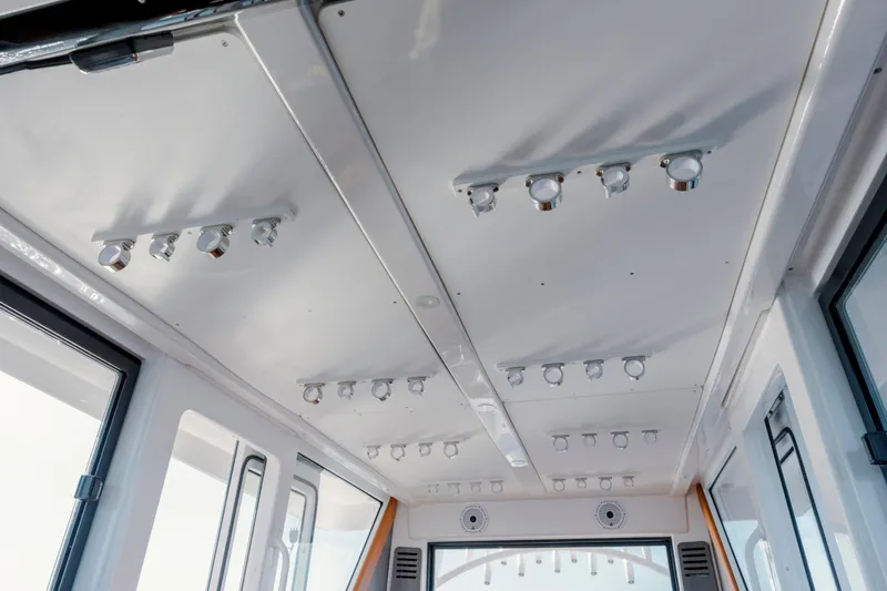 Slide: The Image of Ceiling view of 2024 Invincible 46 Pilothouse with modern lighting fixtures. - 19