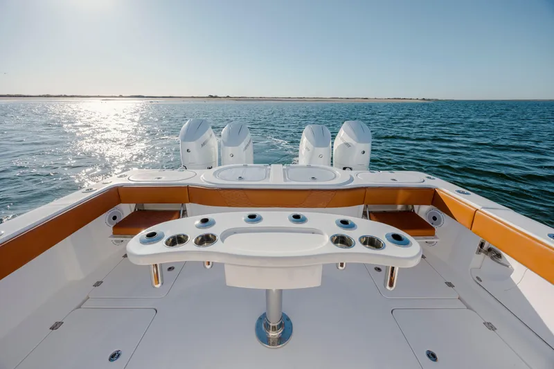 Slide: The Image of 2024 Invincible 46 Pilothouse boat with quad engines on open water. - 21
