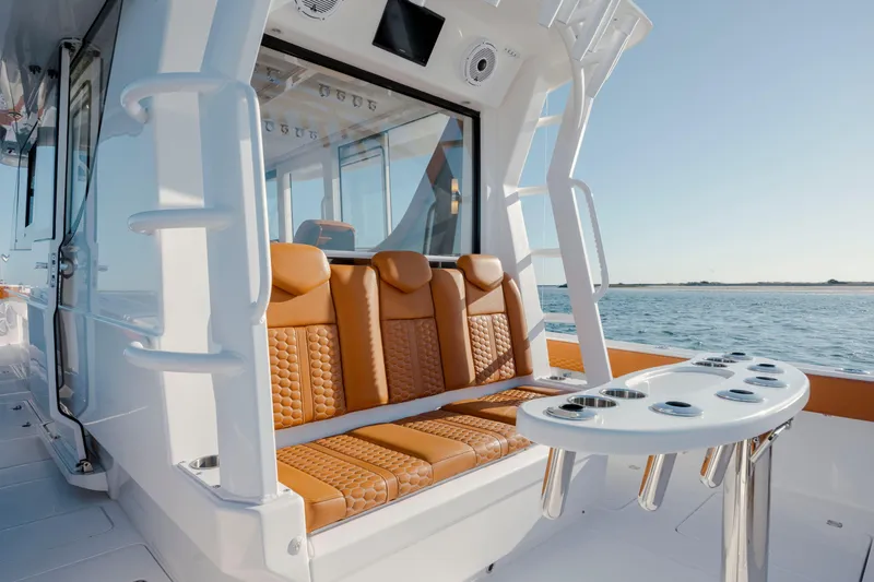 Slide: The Image of 2024 Invincible 46 Pilothouse boat with luxurious seating and ocean view. - 25