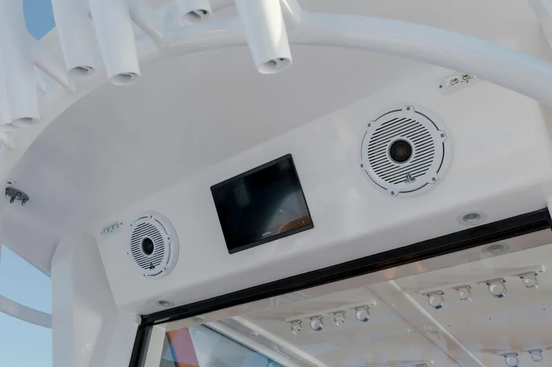 Slide: The Image of 2024 Invincible 46 Pilothouse interior with speakers and screen, showcasing modern design. - 30