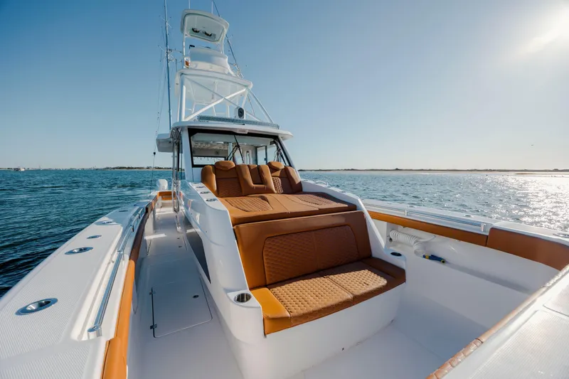 Slide: The Image of 2024 Invincible 46 Pilothouse yacht with luxurious seating on open water. - 35