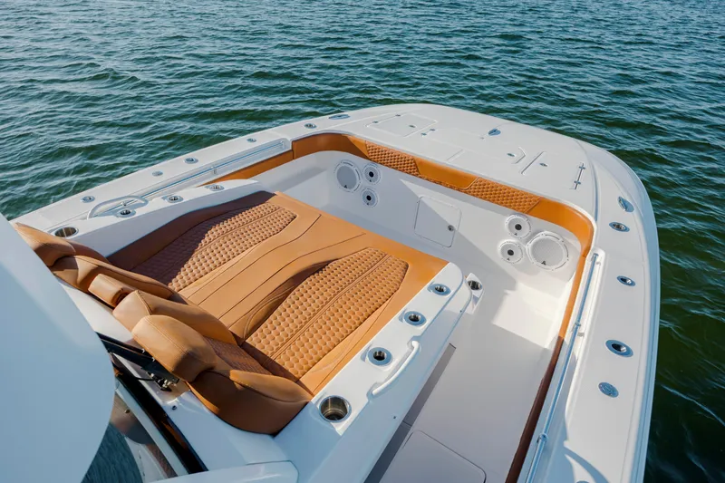 Slide: The Image of 2024 Invincible 46 Pilothouse boat with luxurious seating on open water. - 37