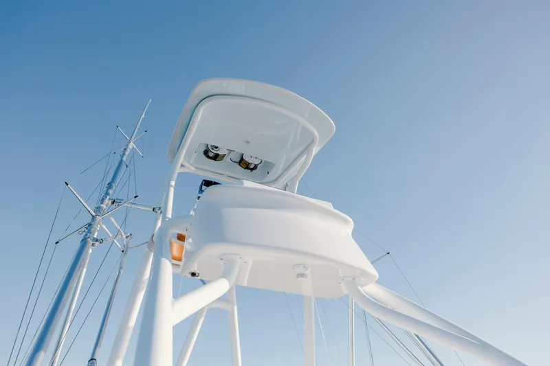 Slide: The Image of 2024 Invincible 46 Pilothouse tower against clear blue sky. - 42