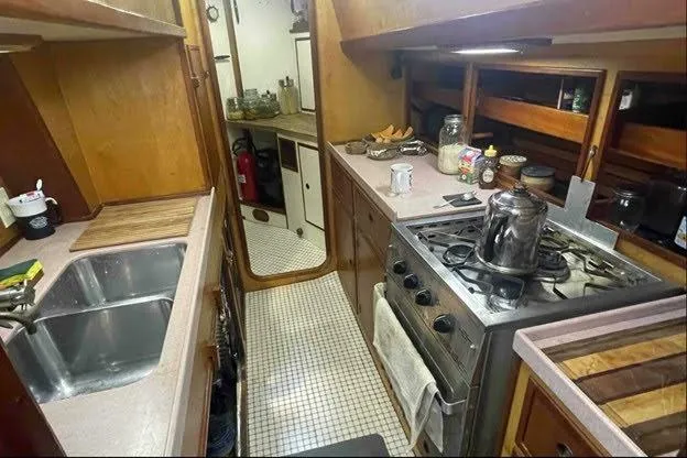 Slide: The Image of Cozy kitchen interior of 1992 Bruce Bingham Custom 47 Steel Hull yacht. - 16