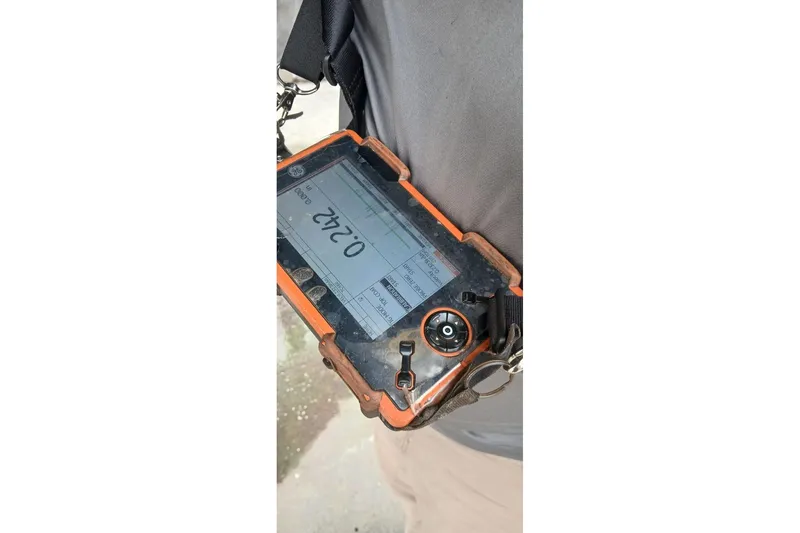 Slide: The Image of Handheld device displaying measurement, related to Bruce Bingham Custom 47 Steel Hull, 1992 model. - 17