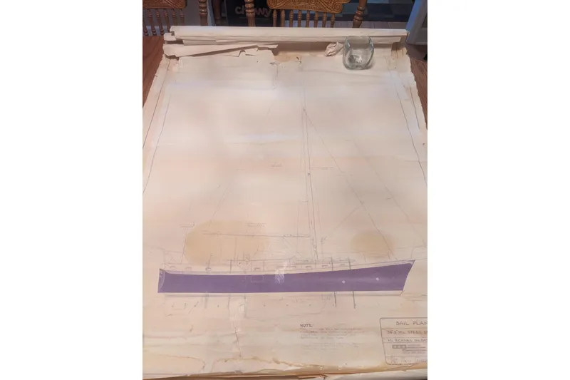 Slide: The Image of Blueprint of 1992 Bruce Bingham Custom 47 Steel Hull sailboat on table. - 24