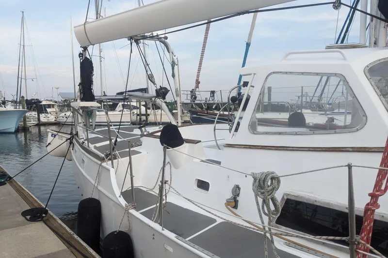 Slide: The Image of 1992 Bruce Bingham Custom 47 Steel Hull sailboat docked at marina. - 3