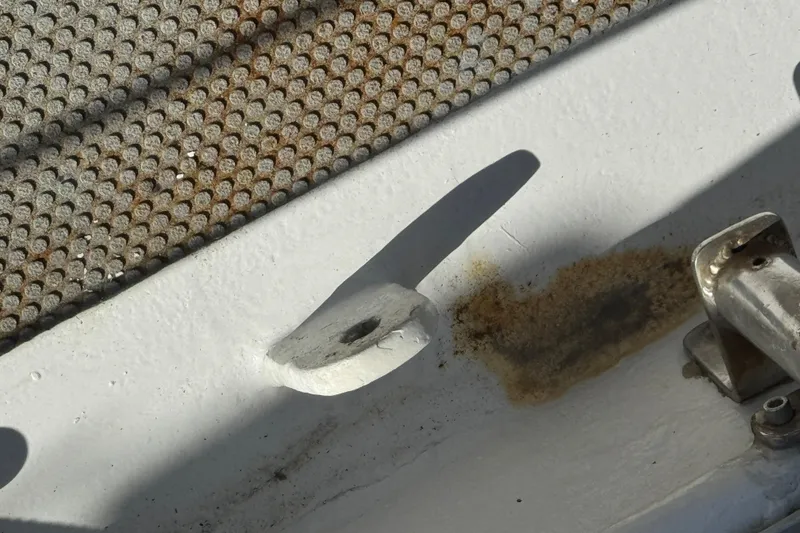 Slide: The Image of Close-up of 1992 Bruce Bingham Custom Steel Hull 47 deck with rust and textured surface. - 40