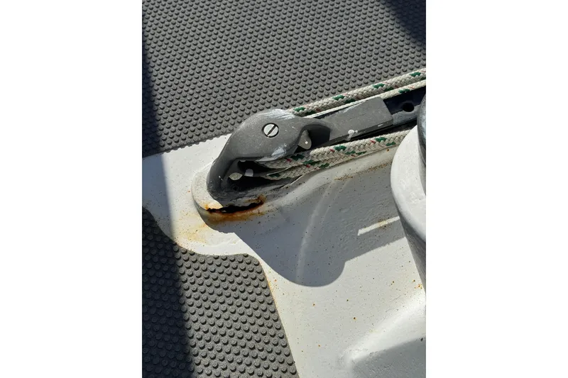 Slide: The Image of Close-up of a 1992 Bruce Bingham Custom Steel Hull 47 deck fitting with rope. - 42