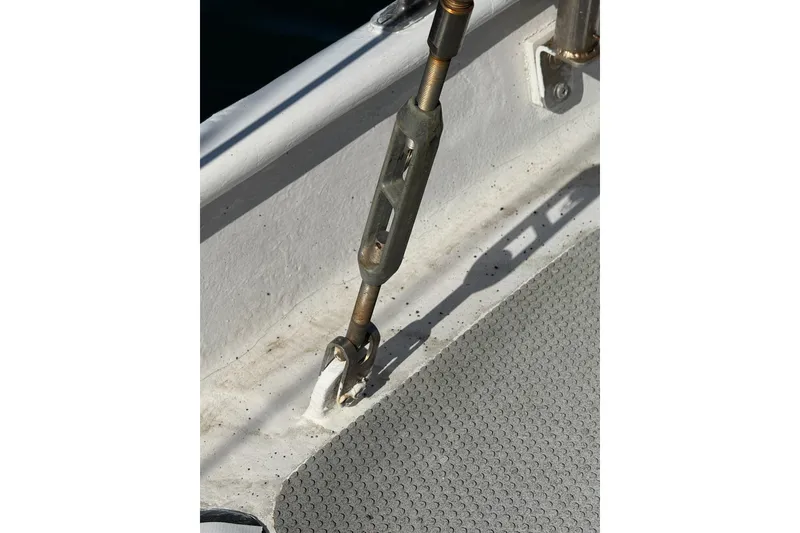 Slide: The Image of Close-up of a turnbuckle on a 1992 Bruce Bingham Custom Steel Hull 47 boat deck. - 48