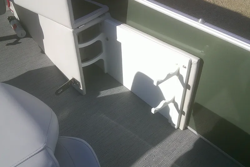 Slide: The Image of Interior of 2026 Godfrey Sweetwater 2286 FS boat, featuring seating and storage compartments. - 13