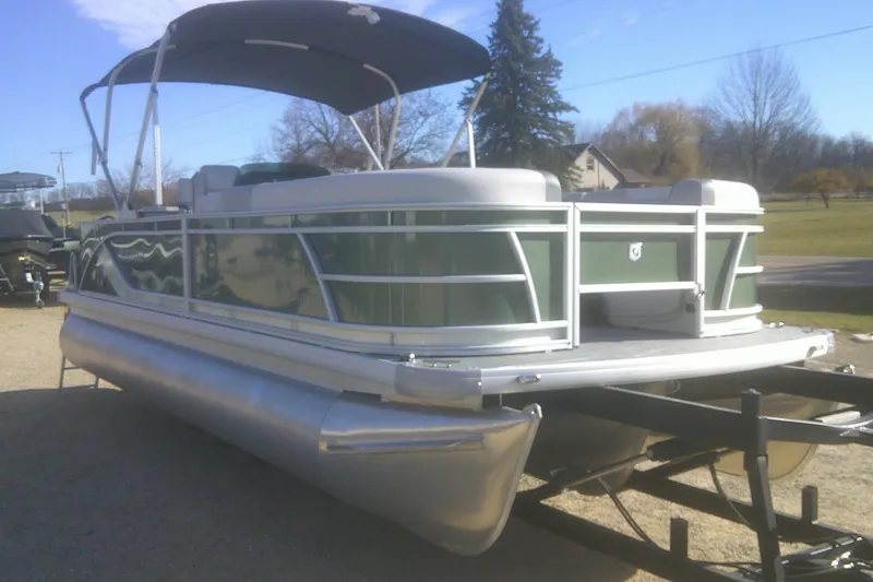 Slide: The Image of 2026 Godfrey Sweetwater 2286 FS pontoon boat on trailer, sunny day. - 3