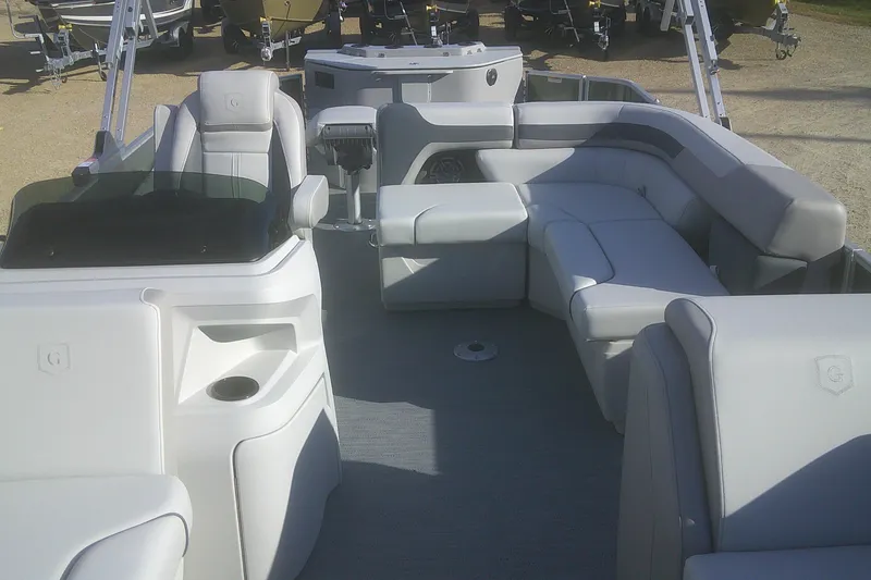 Slide: The Image of 2026 Godfrey Sweetwater 2286 FS pontoon boat interior with plush seating and modern design. - 4