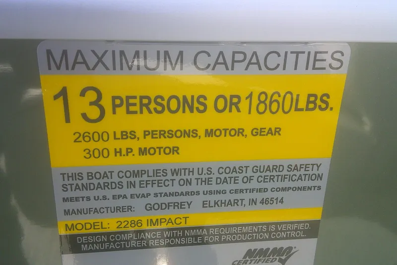 Slide: The Image of 2026 Godfrey Sweetwater 2286 FS boat capacity label: 13 persons or 1860 lbs, 300 HP motor. - 7