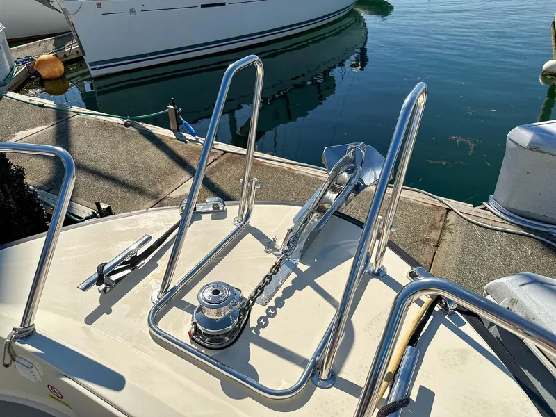 Slide: The Image of 2019 Targa 32 boat deck with anchor and railing in marina. - 11