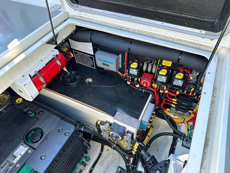 Slide: The Image of Engine compartment of a 2019 Targa 32 boat, showcasing wiring and components. - 13