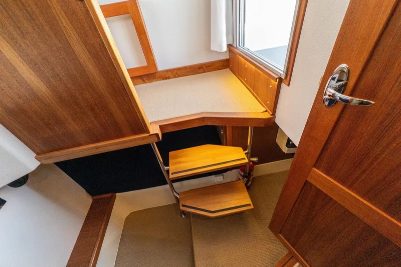 Slide: The Image of Interior of 2019 Targa 32 boat with wooden stairs and door. - 30