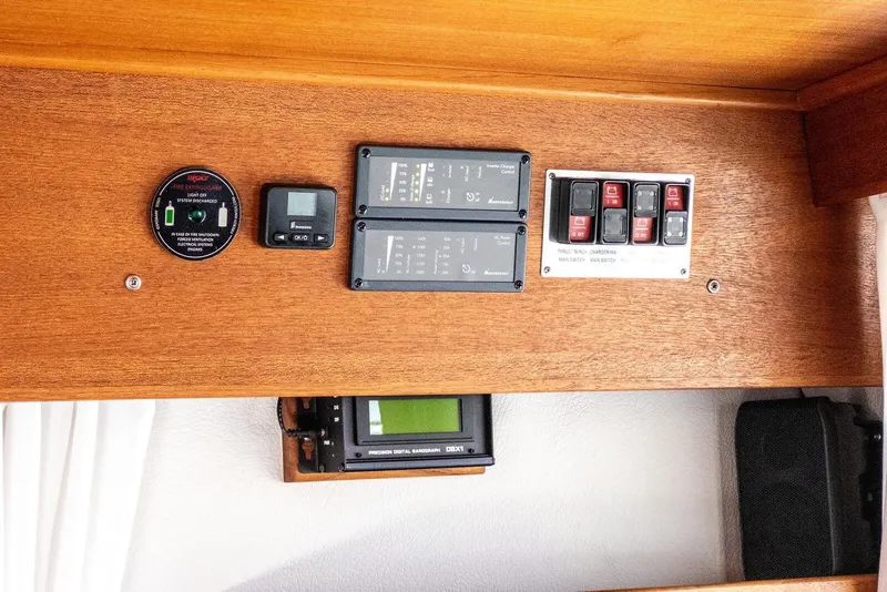 Slide: The Image of Control panel of a 2019 Targa 32 boat with various switches and gauges. - 35