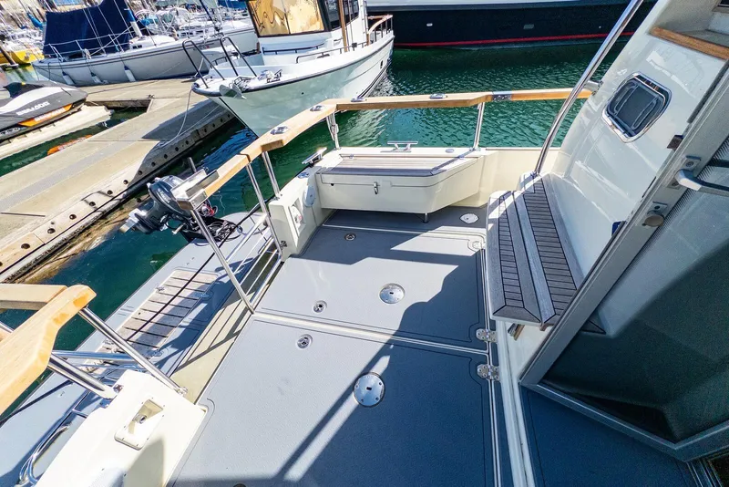 Slide: The Image of 2019 Targa 32 boat deck with seating, docked at marina. - 7