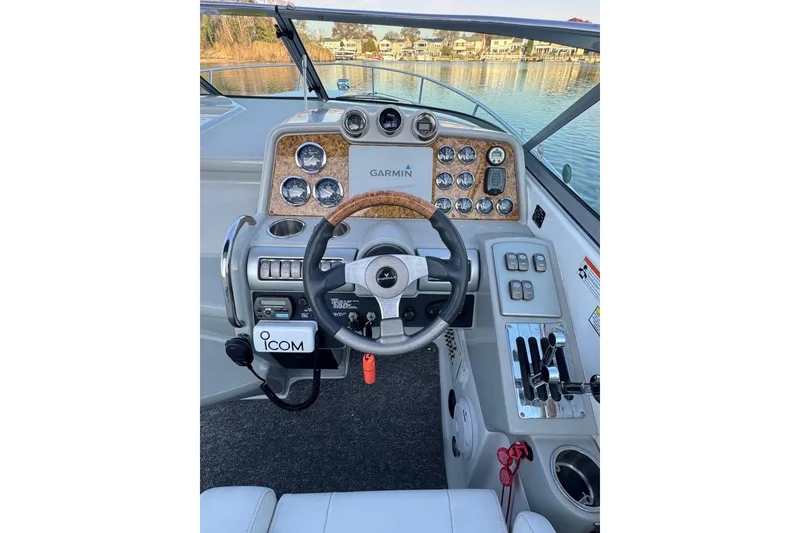 Slide: The Image of 2007 Formula 310 Sun Sport boat dashboard with Garmin navigation and Icom communication systems. - 10