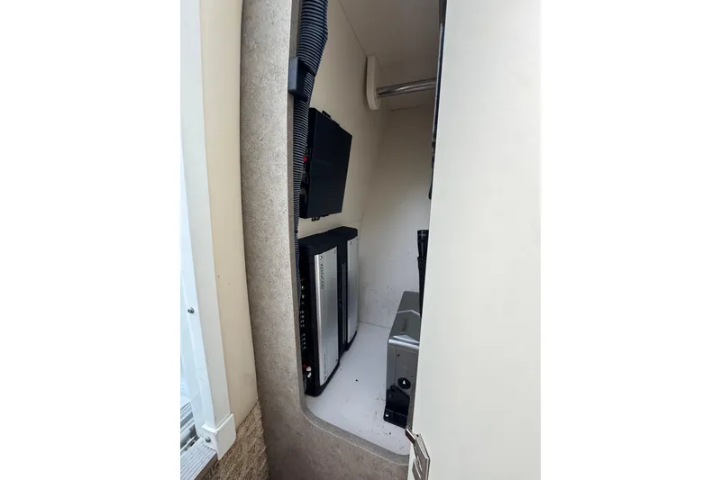 Slide: The Image of Interior electronics compartment of 2007 Formula 310 Sun Sport boat. - 17