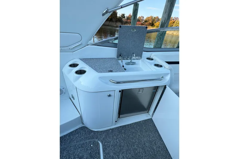 Slide: The Image of 2007 Formula 310 Sun Sport boat interior with sink and storage area. - 7
