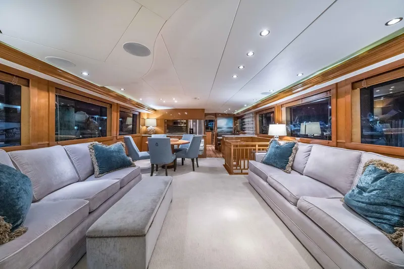 Slide: The Image of Luxurious interior of a 2002 Hatteras Motor Yacht with elegant seating and dining area. - 25