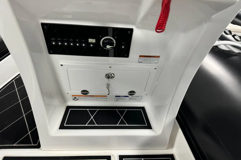 Slide: The Image of Control panel of Aquaform 200 AF boat, 2023 model, featuring switches and a key lock. - 3