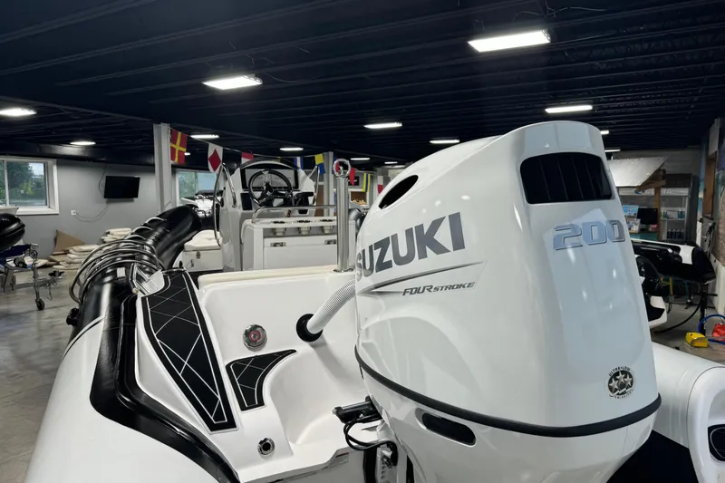 Slide: The Image of Aquaform 200 AF boat with Suzuki 200 horsepower engine, 2023 model, in showroom. - 6