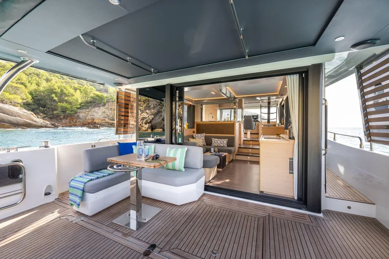 Slide: The Image of Luxurious 2026 Beneteau Swift Trawler 54 yacht interior with elegant seating and scenic ocean view. - 37