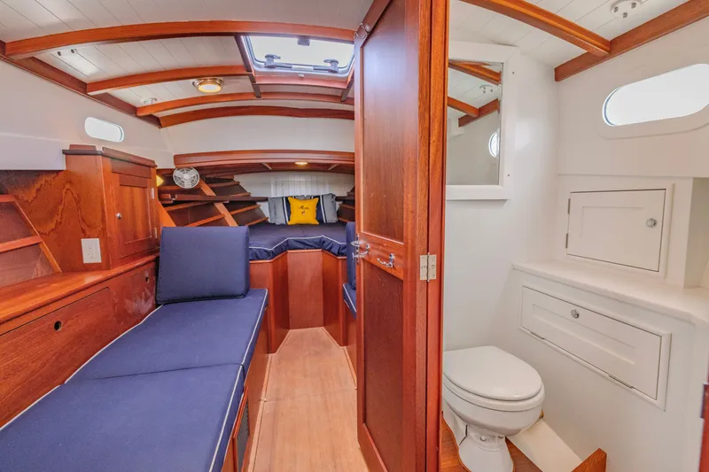 Slide: The Image of Interior of 2021 Brooklin Boat Yard 32 Express, featuring cozy cabin and compact bathroom. - 26