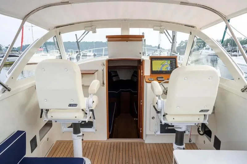 Slide: The Image of Interior of 2021 Brooklin Boat Yard 32 Express with helm and navigation system. - 19
