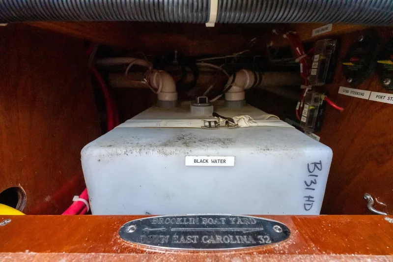 Slide: The Image of 2021 Brooklin Boat Yard 32 Express black water tank in wooden compartment. - 39