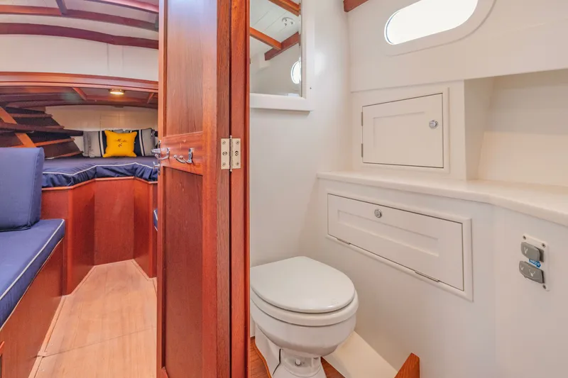 Slide: The Image of Luxurious 2021 Brooklin Boat Yard 32 Express interior with cozy cabin and modern bathroom. - 25