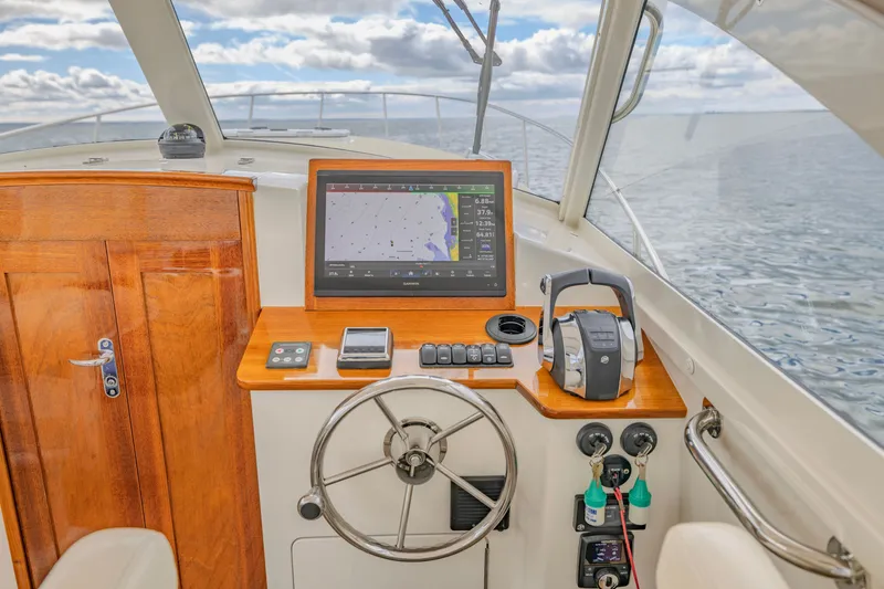 Slide: The Image of Helm of 2021 Brooklin Boat Yard 32 Express with navigation display and controls. - 14